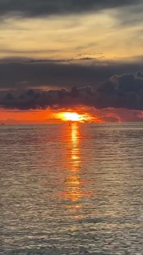 Sunset captured over water in Baan Wok Tum, Thailand