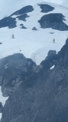 Skiers descend snowy slopes in Estosadok, Russia