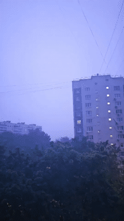 Thunderstorm strikes Khimki cityscape at night