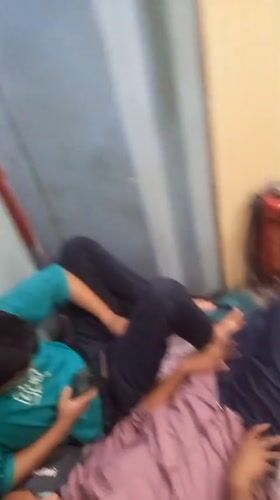 Overnight train passengers rest during journey through Igatpuri