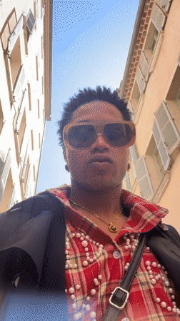 Person records selfie video on narrow street in Toulon