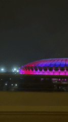 Moscow stadium illuminated with colorful lighting at night