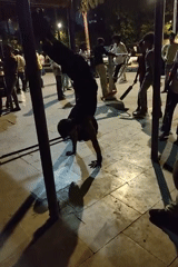 Person performs evening calisthenics workout at Mumbai public park