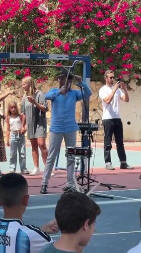 Bucket drumming workshop fills a Netanya schoolyard on a sunny morning