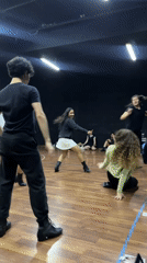 Dance rehearsal in a black-walled studio, Puebla
