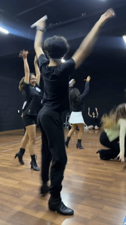 Dance rehearsal in a black-walled studio, Puebla