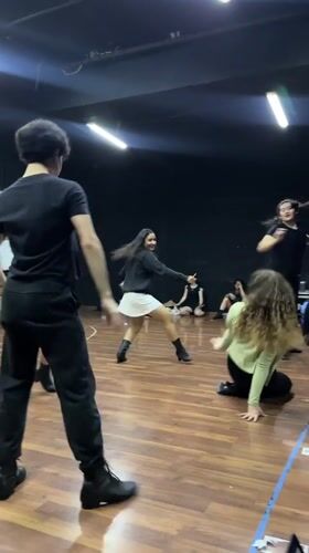 Dance rehearsal in a black-walled studio, Puebla