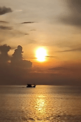 Sunset on the Lhokseumawe shore, fishing boats and all