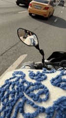 Motorcyclist travels through Moscow traffic in white jacket