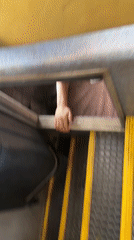 Person in white sneakers sits in compartment, Zhelyava