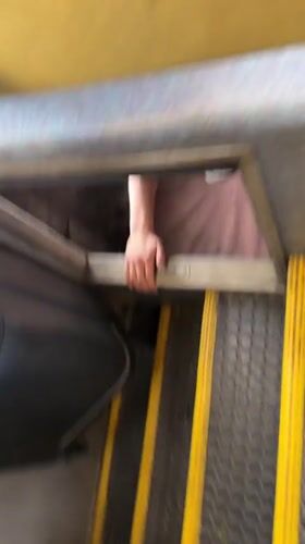 Person in white sneakers sits in compartment, Zhelyava