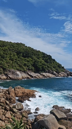 Clear morning on a rocky Patong coastline
