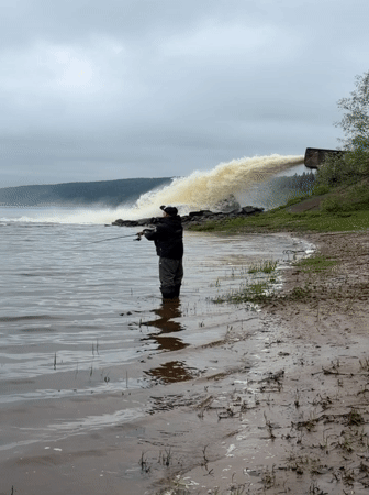Early morning fishing and barge traffic near Ольховка, Russia