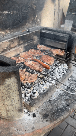 Meat and sausage grilling in brick barbecue structure, Dortmund