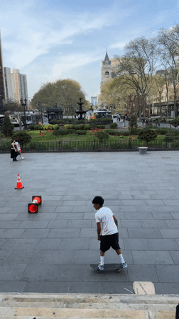 Skaters practice tricks in NYC public square