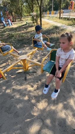 Kids at play in a Krasnyye Barrikady playground on a sunny afternoon