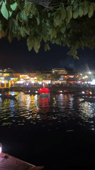 Nighttime lantern festival draws crowds to river town streets