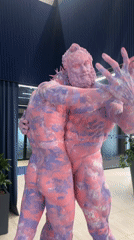 Abstract sculpture of embracing figures displayed in Riga