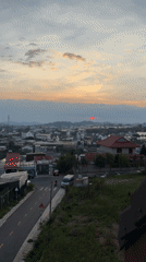 Bright orange sunset observed over Đà Lạt cityscape