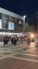 Young adults dance outside dramatic theater in Blagoevgrad