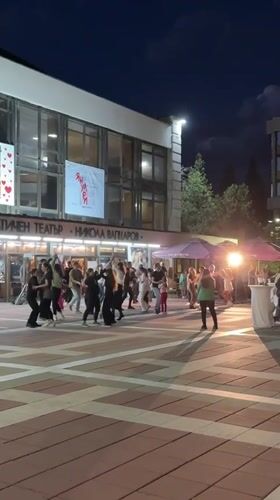 Young adults dance outside dramatic theater in Blagoevgrad