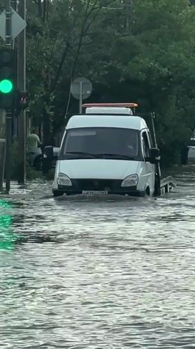 Flooding submerges vehicles on Krasnodar streets, residents wade through water