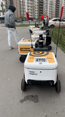Morning street activity with delivery robots in Murino