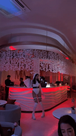 Cocktails and dancing at a lit-up North Kuta bar