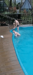 Boys swimming at outdoor pool in Medoveevka, Russia