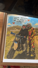 Person showcases motorcycle memorabilia and tech gear in bedroom