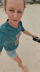 Woman films beach walk in Bai Chay Ward Vietnam