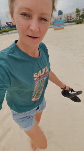 Woman films beach walk in Bai Chay Ward Vietnam