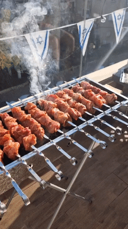 Festive barbecue celebration with Israeli decorations documented in Ramat Gan