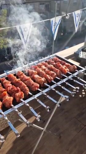 Festive barbecue celebration with Israeli decorations documented in Ramat Gan
