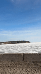 Frozen lake captured on sunny day in Chaykovsky, Russia