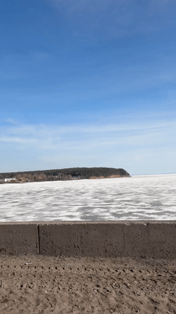 Frozen lake captured on sunny day in Chaykovsky, Russia