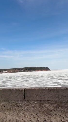 Frozen lake captured on sunny day in Chaykovsky, Russia