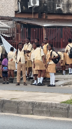 Students outside a school in Ado, Nigeria