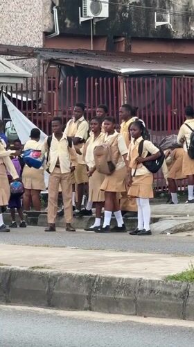 Students outside a school in Ado, Nigeria
