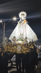 Nighttime Catholic procession winds through Iquique streets
