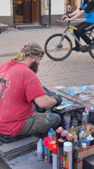 Street artist and pedestrians documented in central Kazan