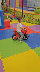 Child plays with toys at indoor playground in Khimki
