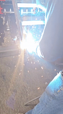 Welder works on industrial machinery in Karnobat, Bulgaria