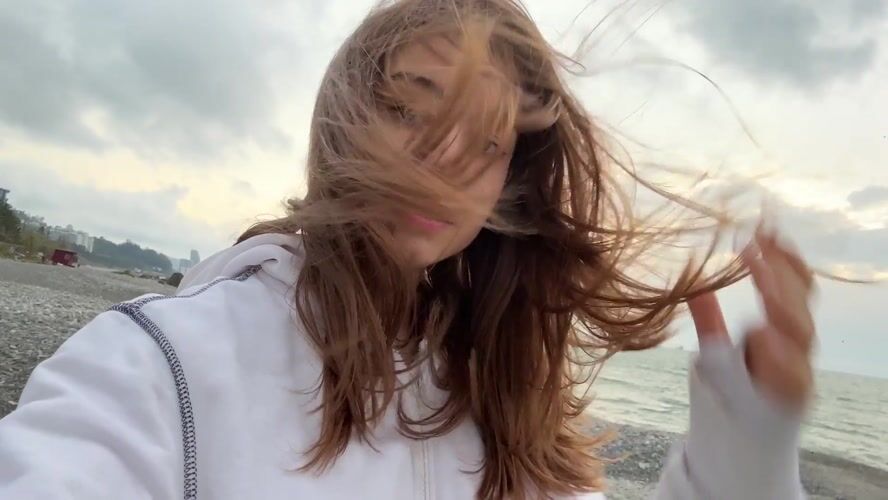 Woman photographed on windy beach in Batumi, Georgia
