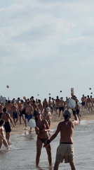 Frisbee and beach games on a crowded Tel Aviv shore