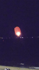 Red sky lantern launched from Nha Trang beach