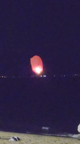 Red sky lantern launched from Nha Trang beach