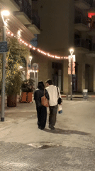 Evening street life continues in Tel Aviv cafes and sidewalks