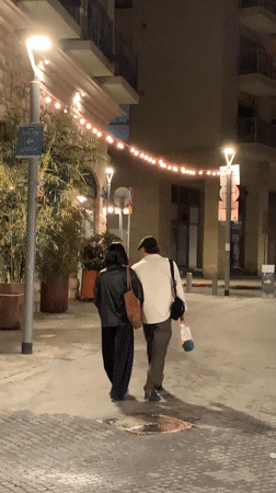 Evening street life continues in Tel Aviv cafes and sidewalks