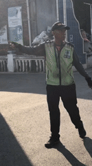 Morning street life and traffic control in Indonesian towns